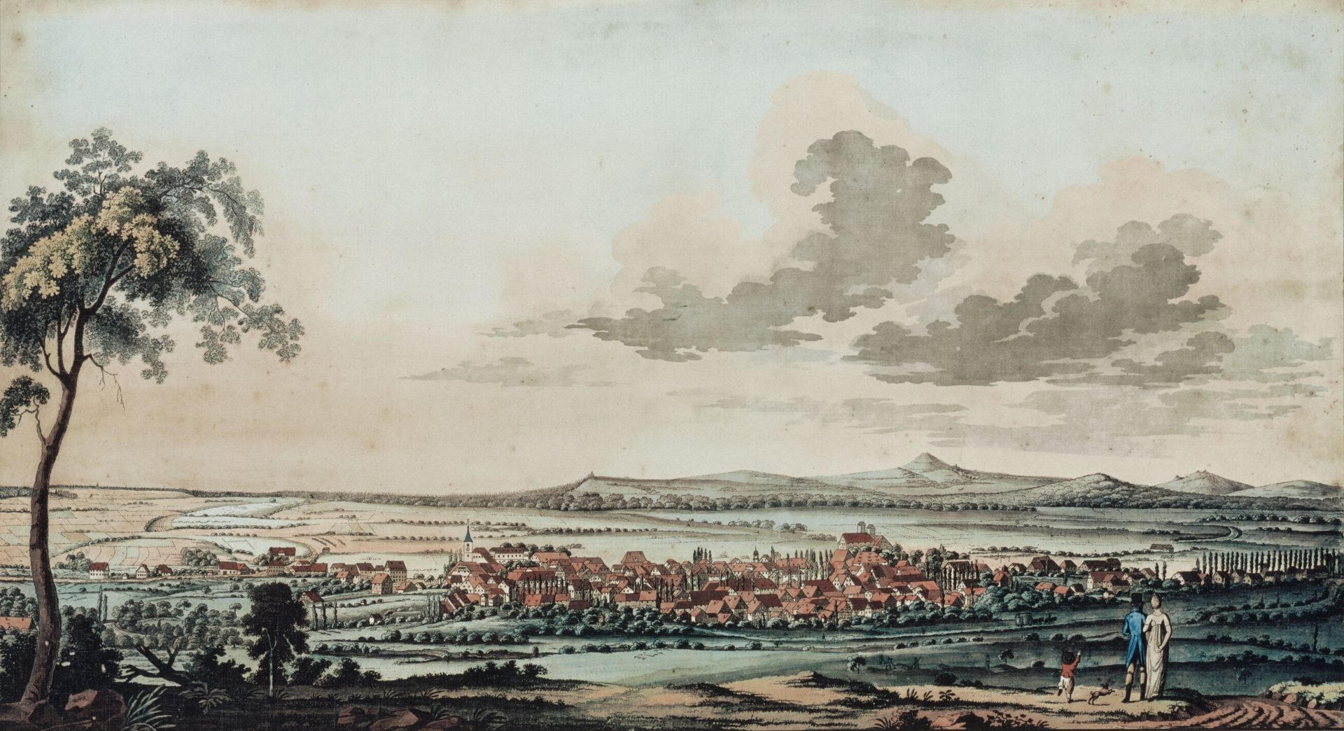 Ein farbiger Kupferstich mit einer Gesamtdarstellung der Stadt Göppingen. Im Vordergrund Staffagefiguren mit Kleidung aus der Zeit um 1800, im Hintergrund verschiedene Berge, z. B. der Hohenstaufen.